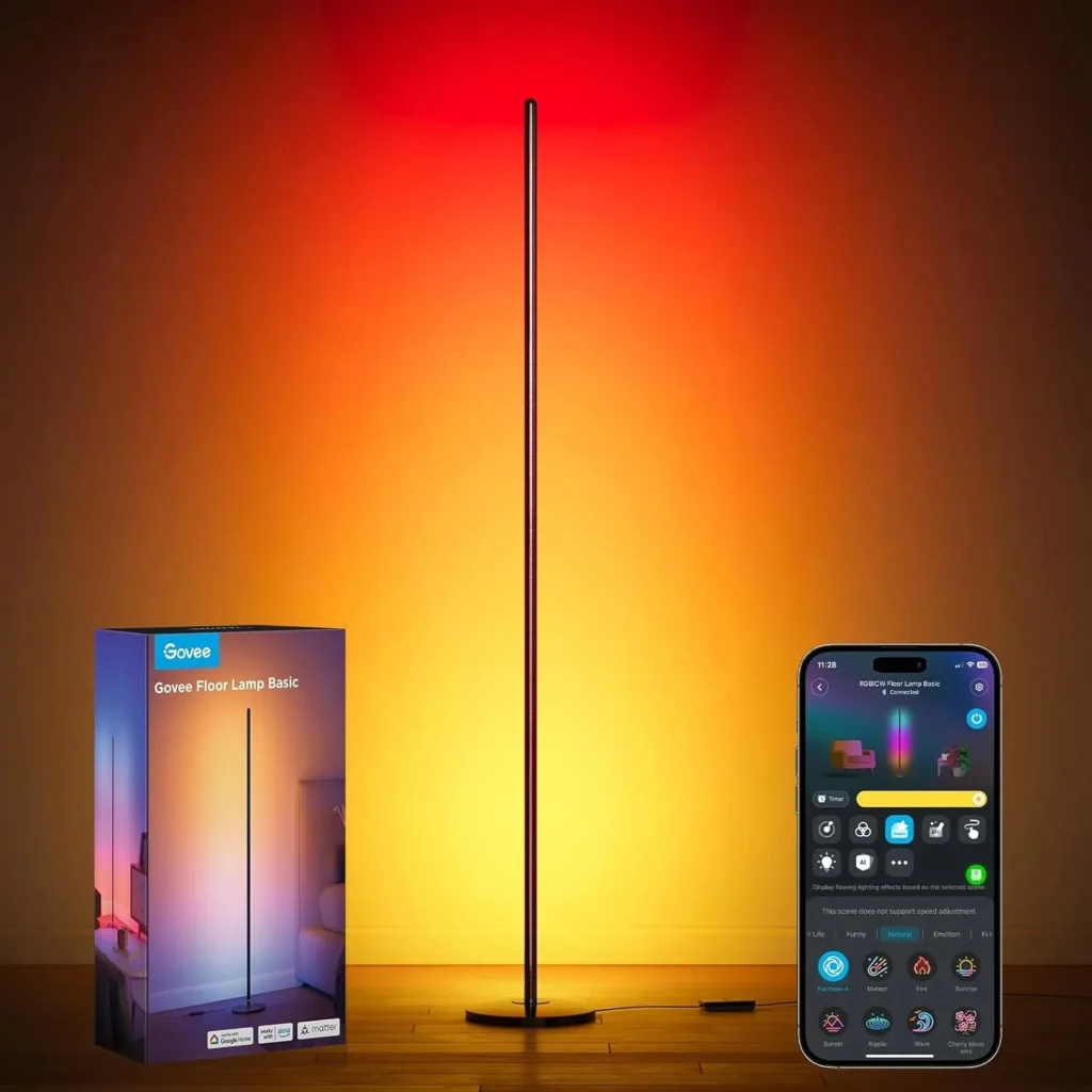 Govee Floor Lamp Basic standing with vibrant red and orange gradient lighting, next to its packaging box and a smartphone showing the app control interface.